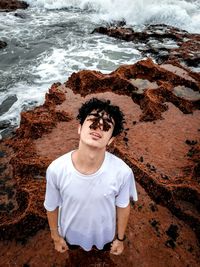 High angle view of man standing on beach