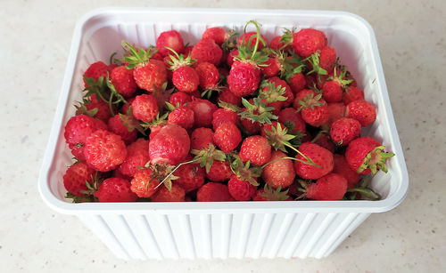 High angle view of strawberries in bowl on table