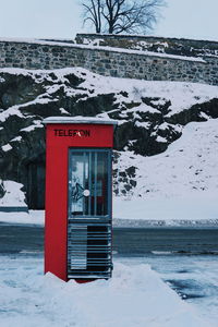 Information sign on snow covered field