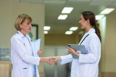 Young doctor examining patient in hospital