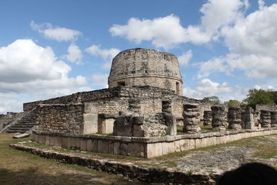 Old ruin building against cloudy sky