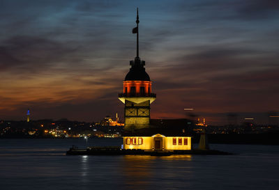 Illuminated building against sky at night