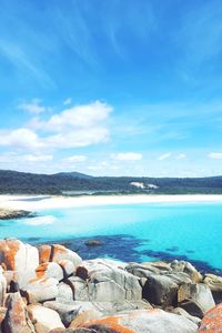 Scenic view of sea against blue sky