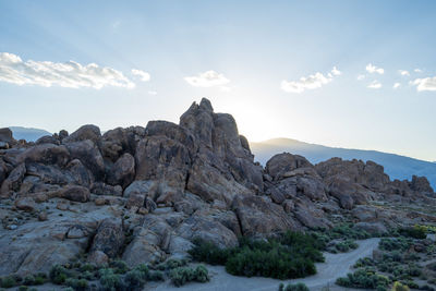 Rock formations on landscape against sky