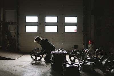 Female mechanic in car garage
