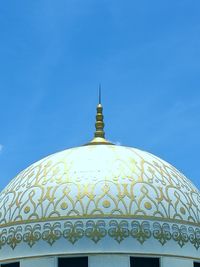 Low angle view of building against blue sky