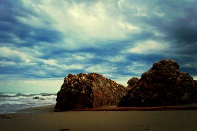 Scenic view of sea against cloudy sky