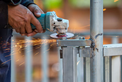 Midsection of man working in factory