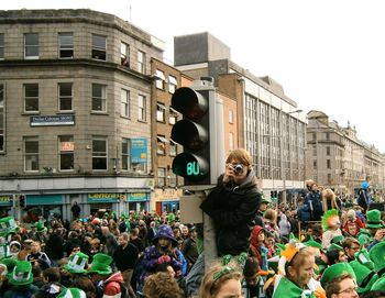 People on street in city against clear sky