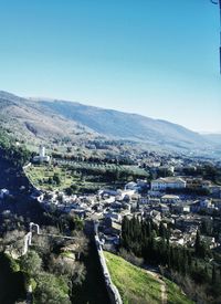 High angle view of townscape against clear blue sky