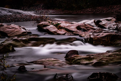 Surface level of stream flowing through rocks