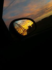 Reflection of sky on side-view mirror