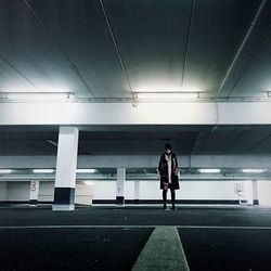 Portrait of woman standing in parking lot