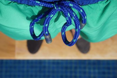 High angle view of rope on blue table