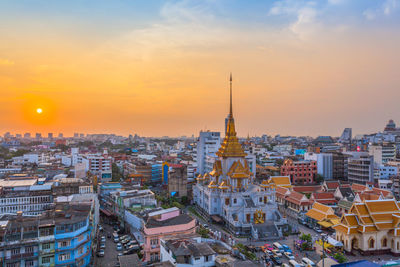 Aerial view of city at sunset