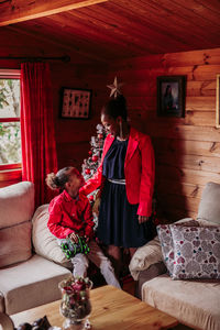 Happy woman with her daughter at home