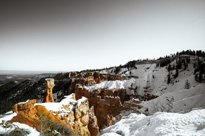 Desaturated monochrome fine art photo style of bryce canyon national park during the day in winter