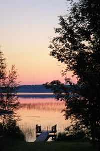 Scenic view of lake against sky during sunset