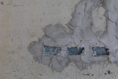 Garbage can against wall