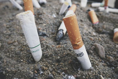 High angle view of cigarette smoking on ground