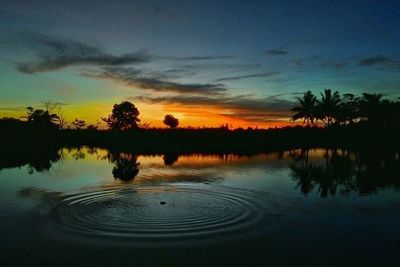 Scenic view of lake at sunset