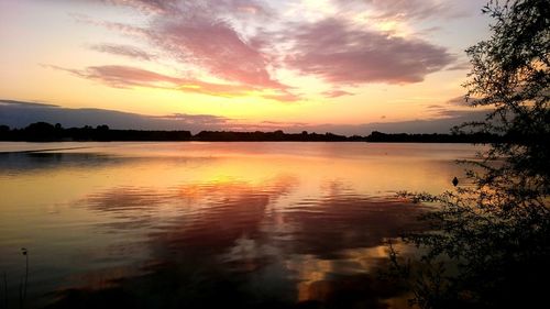 Scenic view of lake at sunset