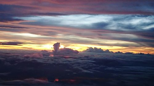 Silhouette landscape against sky during sunset