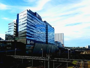 Modern buildings against sky in city