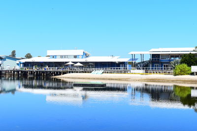 Built structures against clear blue sky