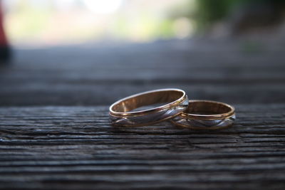 Wedding rings on wooden plank