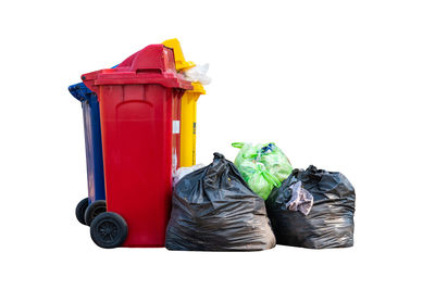 Close-up of garbage bin against white background