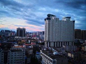 Modern buildings in city against sky