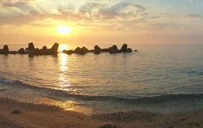 Scenic view of sea against sky during sunset