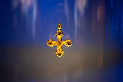 Low angle view of yellow lamp against sky