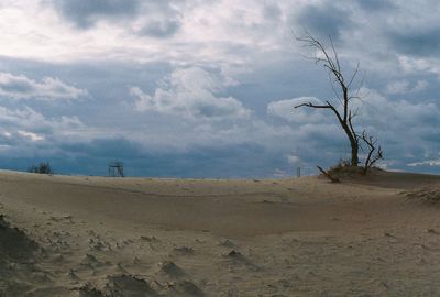 Scenic view of landscape against cloudy sky