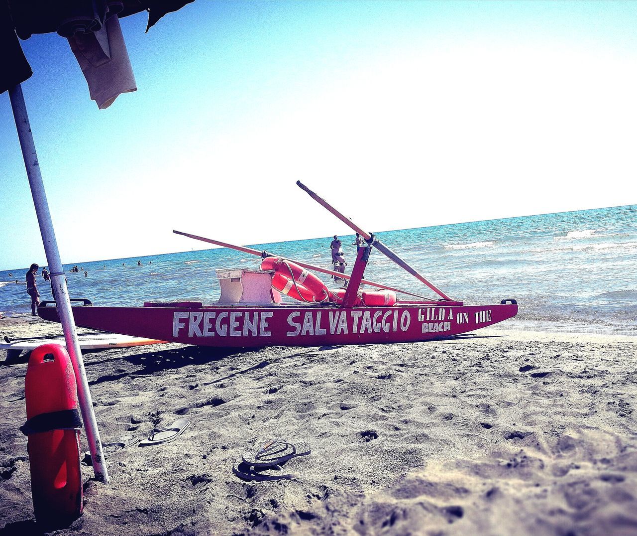 sea, horizon over water, beach, water, sand, shore, text, transportation, outdoors, day, nature, sky, nautical vessel, clear sky, no people, scenics, beauty in nature, rescue, moored