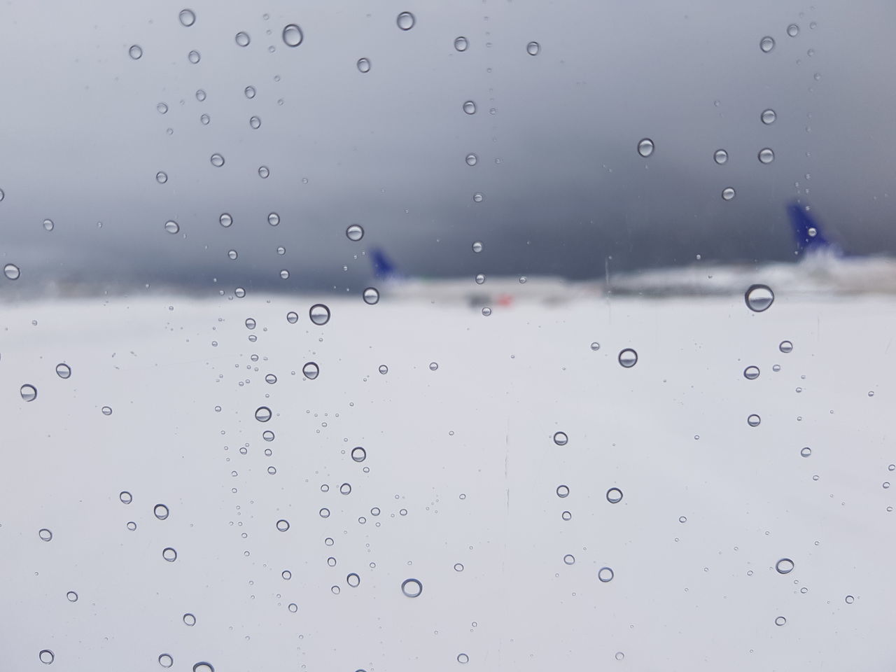 RAINDROPS ON GLASS WINDOW