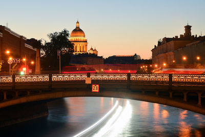 Bridge over river at night