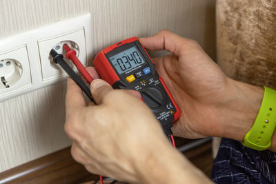 Midsection of man working on table