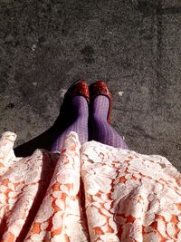 Low section of woman standing on tiled floor