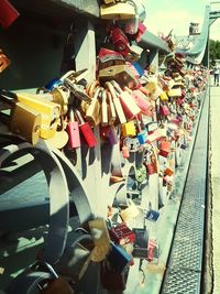 Close-up of padlocks hanging on railing