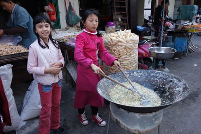 Group of people standing in market