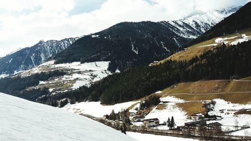 Scenic view of snow covered mountains against sky