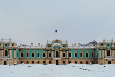 Buildings against sky during winter