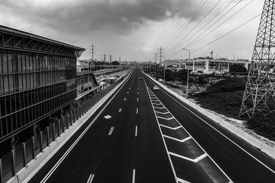 View of railroad tracks against cloudy sky