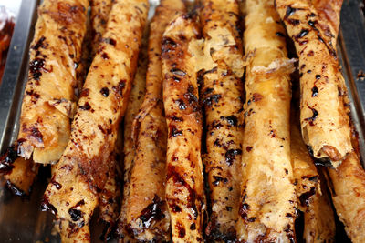 High angle view of meat on barbecue grill