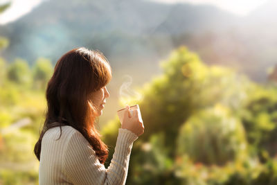 Close-up of woman holding drink