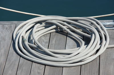 Coiled hose pipe at the harbour