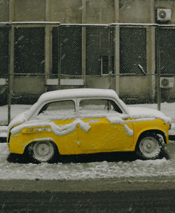 Yellow car on street during winter