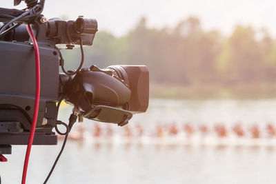 Close-up of camera against sea